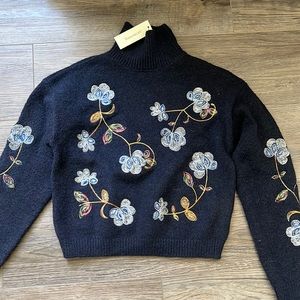 Mi ami from Francesca’s, XS navy blue sweater, NWT, embroidered flower detail.